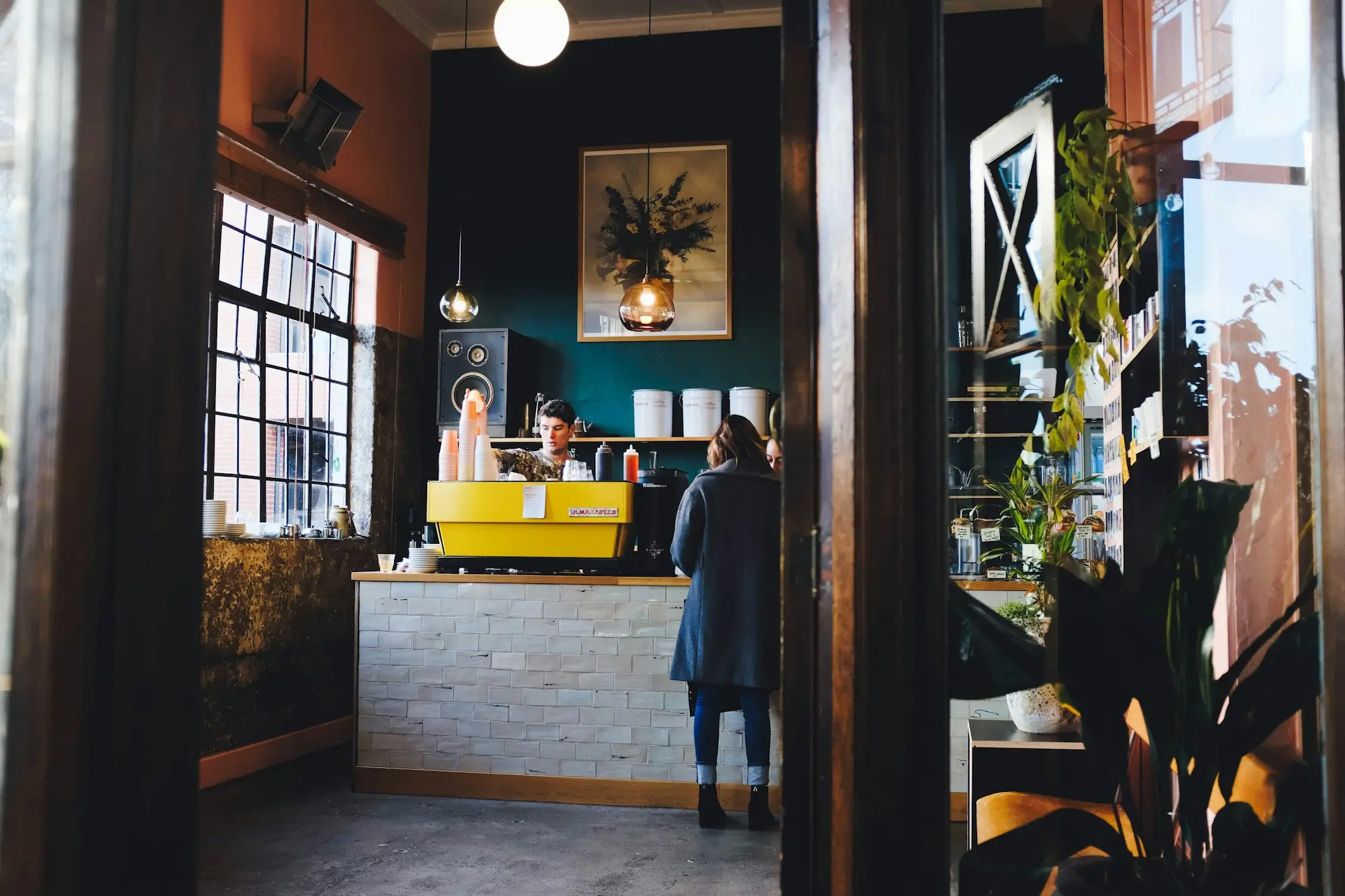 Café owner at the front counter