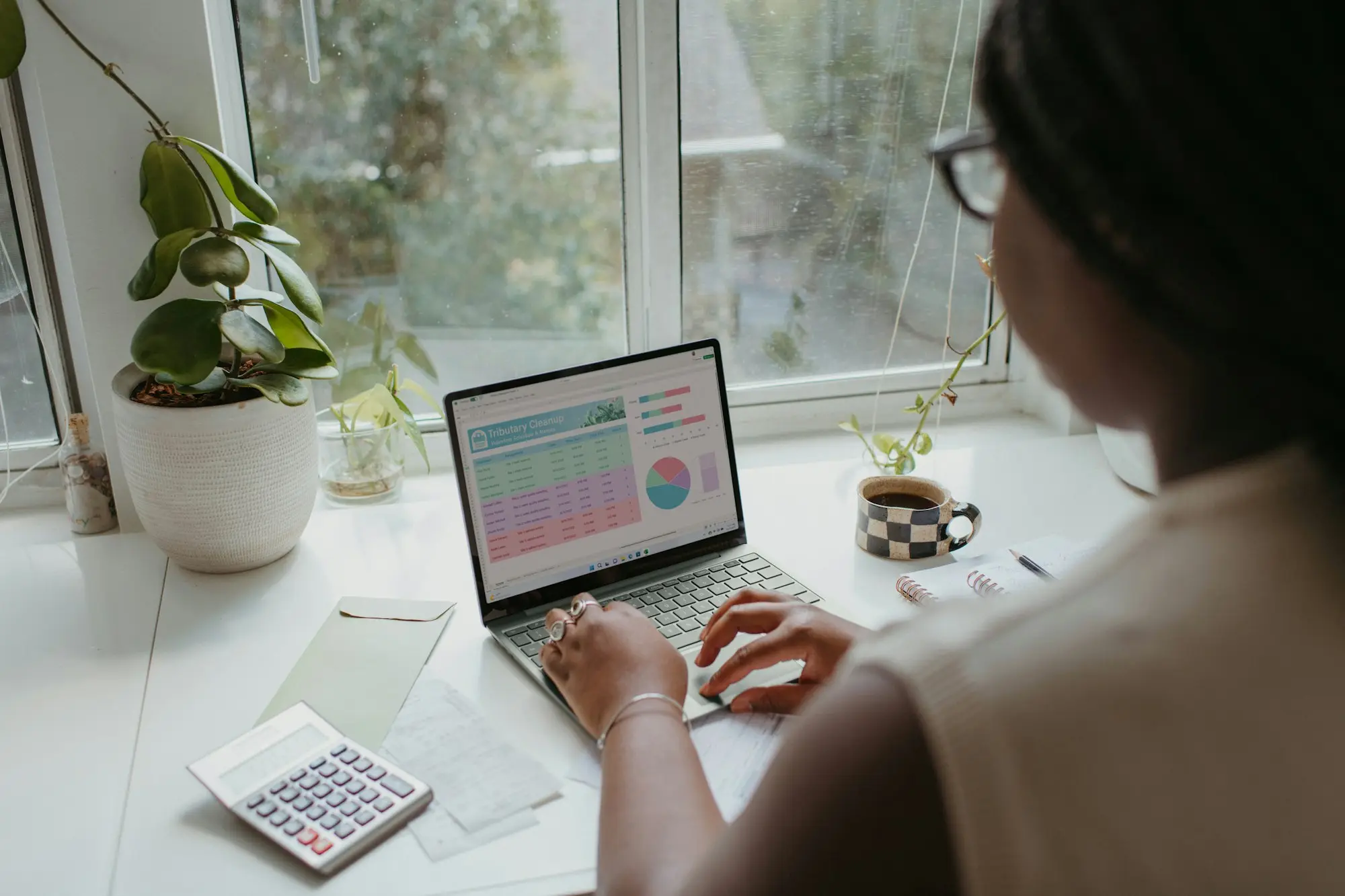 Person planning finances on a laptop