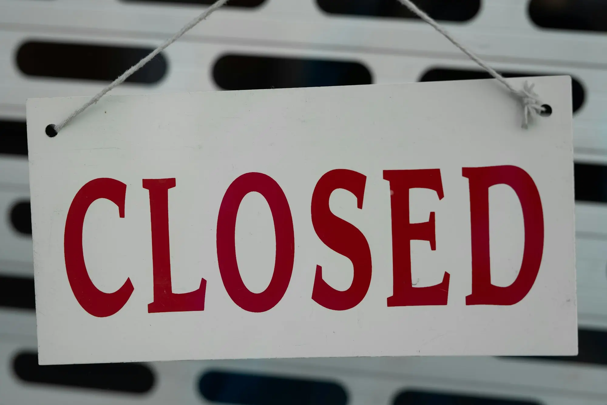Closed sign on a shop door